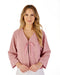 Woman wearing a pink textured Bed Jacket on a white background